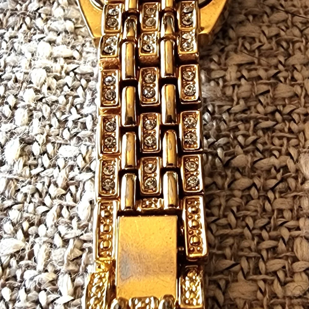 Vintage Nolan Miller crystal gold-tone watch.
